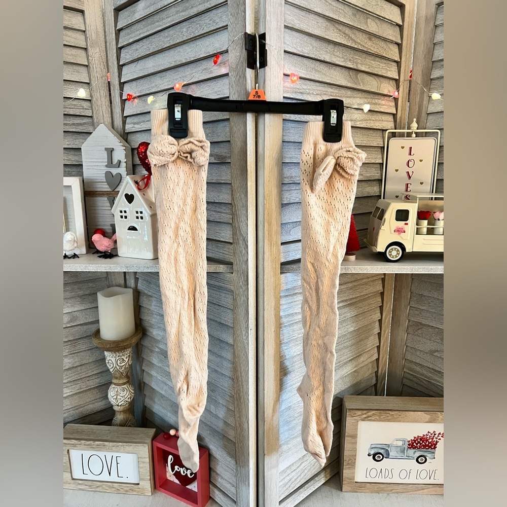 4 PAIRS of Ladies’ tall Boot Socks with adorable bow detail.